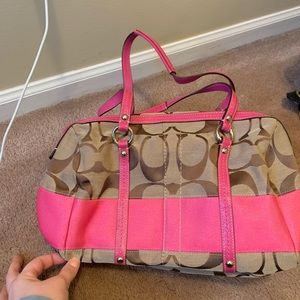 Brown and hot pink Coach purse. Never been used